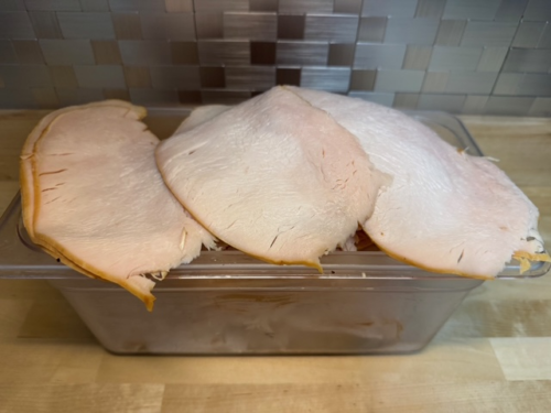 A bin of oven roasted turkey