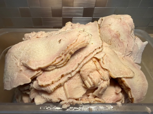 A bin of fire roasted deli turkey