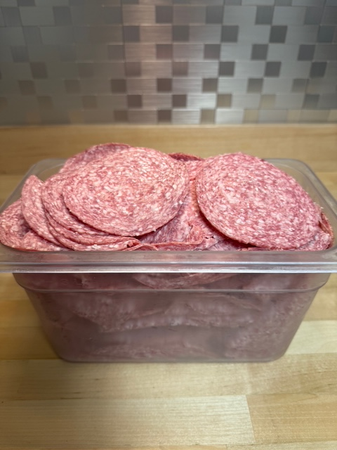 A bin full of hard salami