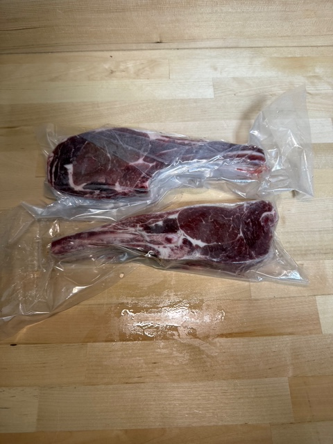 Two vacuum sealed packages of veal loin chops
