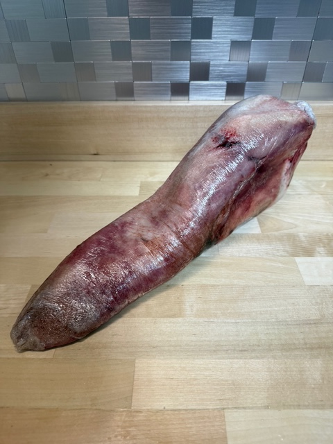 Frozen vacuum sealed whole beef tongue.