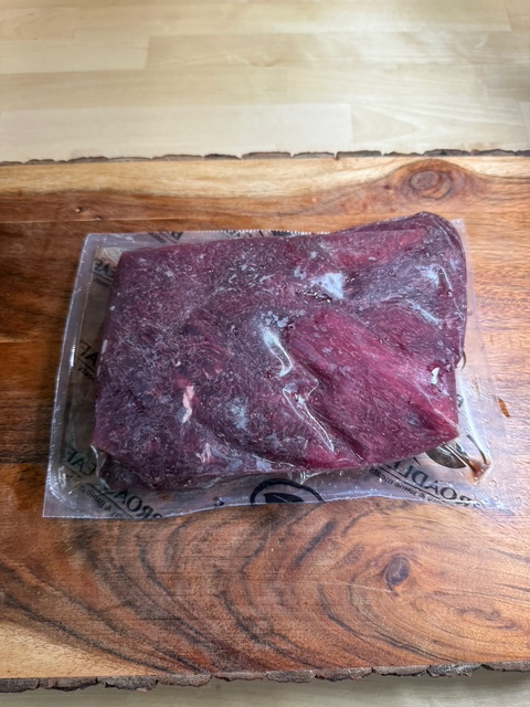 A frozen vacuum sealed elk medallion