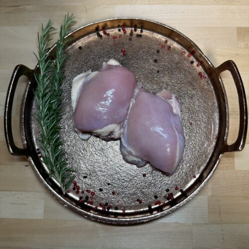 Boneless Chicken Thighs on a tray of garnishments