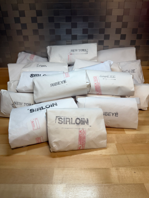 A pile of steaks for a steak pack