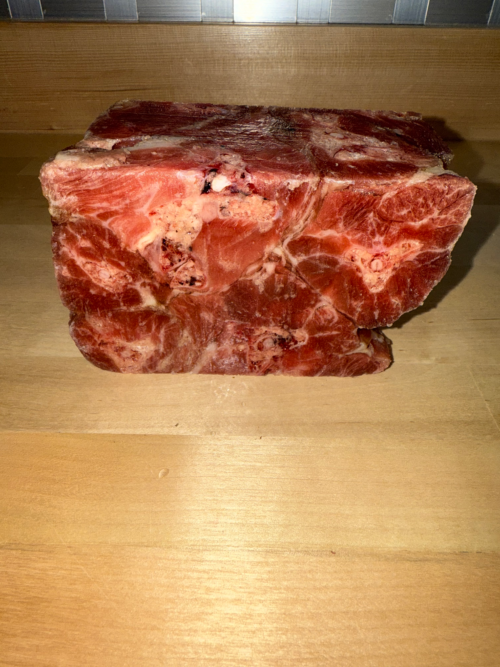 Frozen turkey backs frozen together and cut into two pound cube