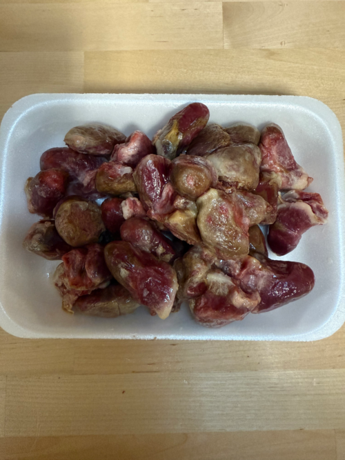 Frozen Duck hearts on a tray